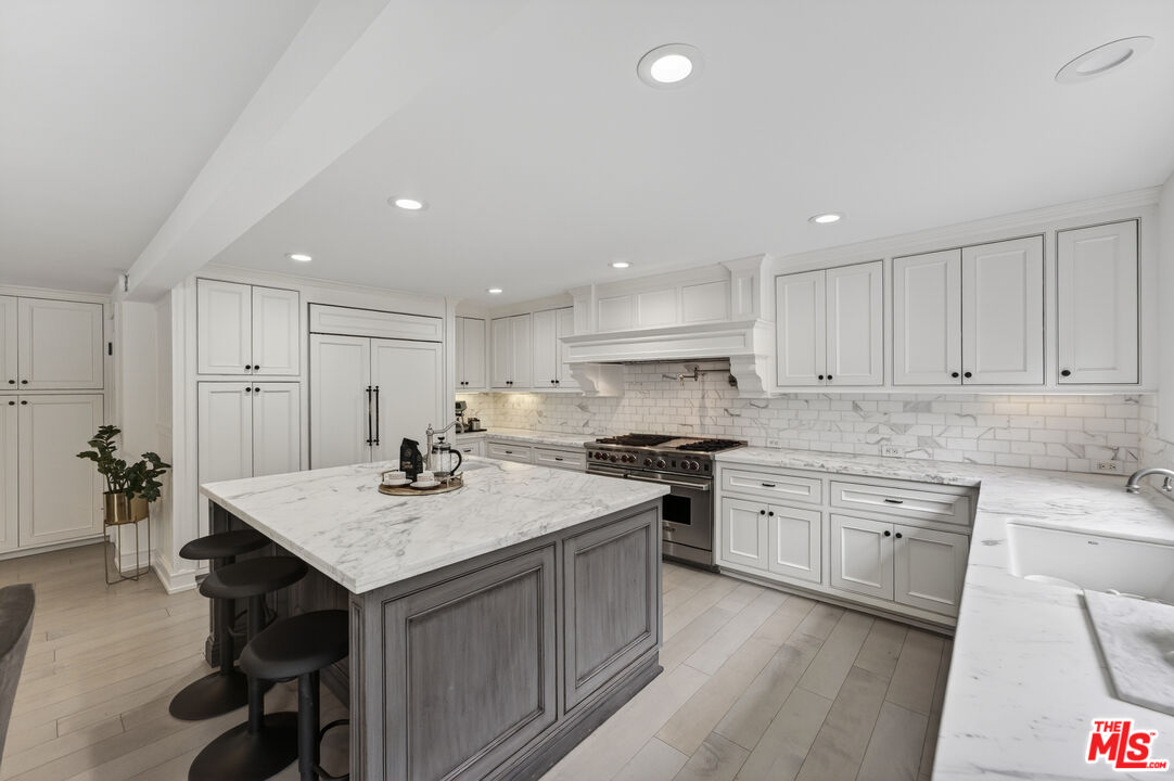 760 South San Rafael Avenue Pasadena, CA 91105 - Photo 13 of 45 a kitchen with stainless steel appliances granite countertop a sink stove and refrigerator
