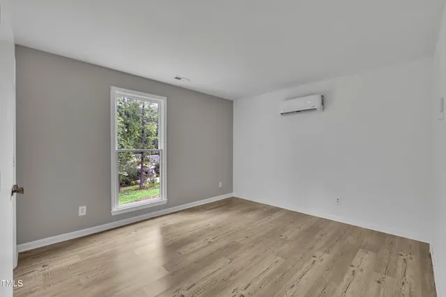 a kitchen with granite countertop white cabinets and stainless steel appliances