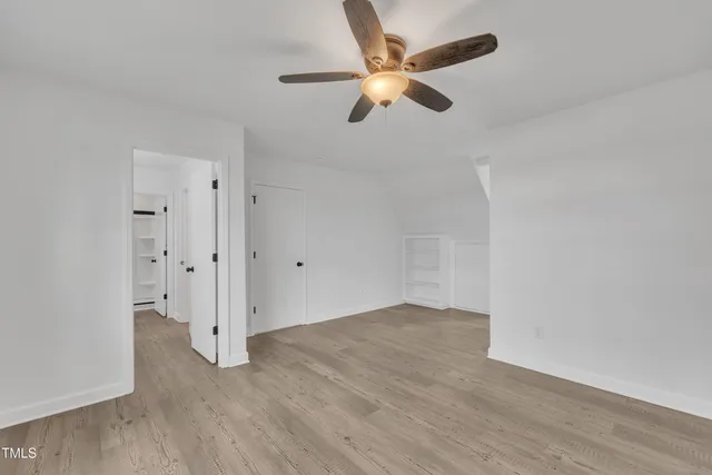 a bathroom with double vanity sinks and a mirror