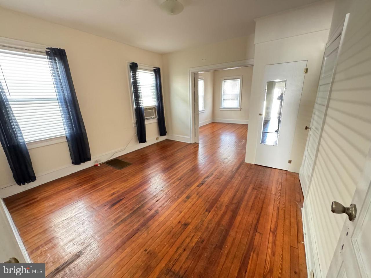 60 Wiggins Street, Unit 1 Princeton, NJ 08540 - Photo 5 of 10 a view of an empty room with wooden floor and a window
