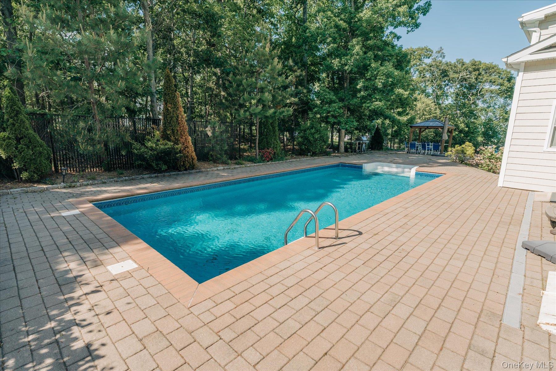 32 Red Creek Road Hampton Bays, NY 11946 - Photo 16 of 18 a view of a backyard with large trees