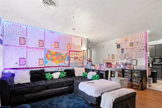 a bed room with a bed and a flat screen tv