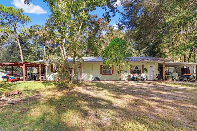 a front view of a building with a garden