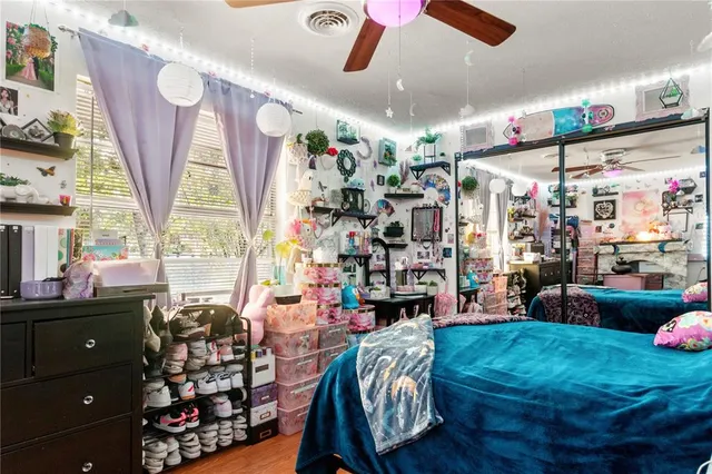 a bathroom with a sink mirror vanity and toilet