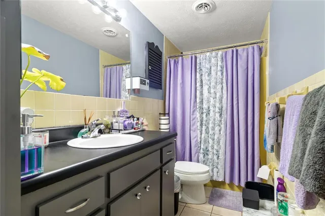 a bathroom with a sink vanity and a mirror