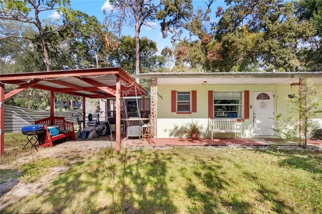 a view of house with outdoor seating