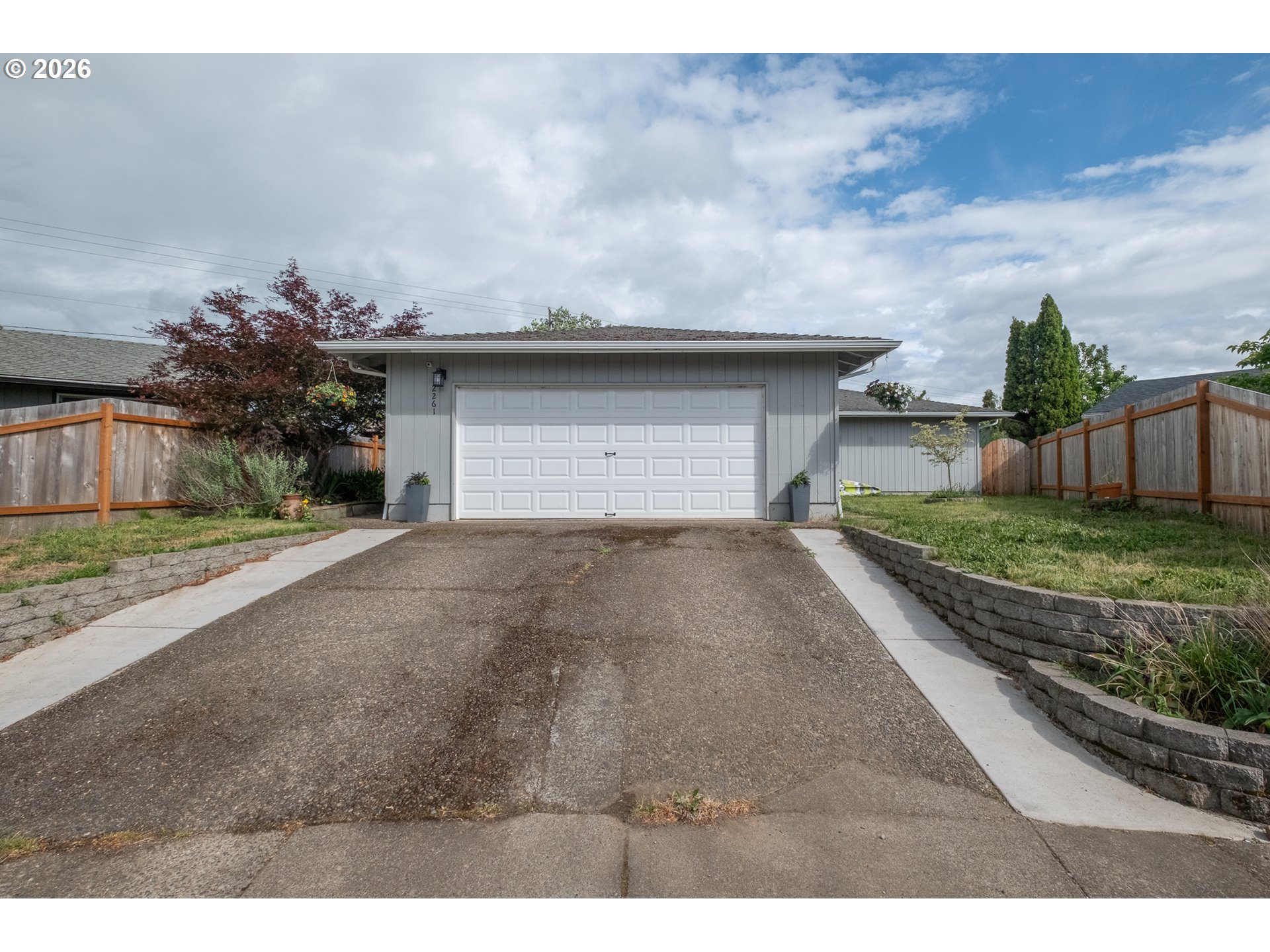 2261 Fulton Place Southeast Albany, OR 97322 - Photo 2 of 48 a front view of a house with a yard and garage