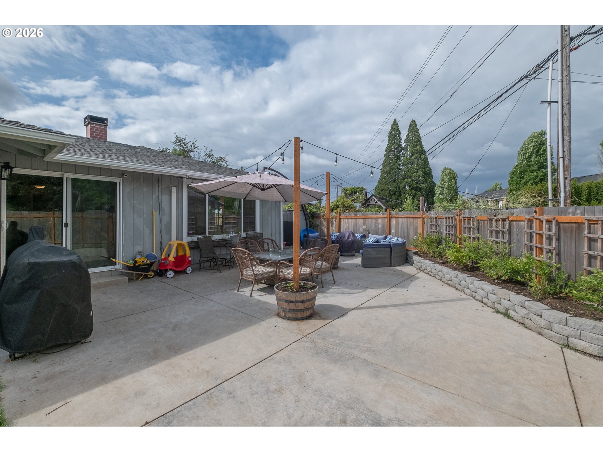 2261 Fulton Place Southeast Albany, OR 97322 - Photo 36 of 48 a view of a patio with couches and table and chairs and potted plants