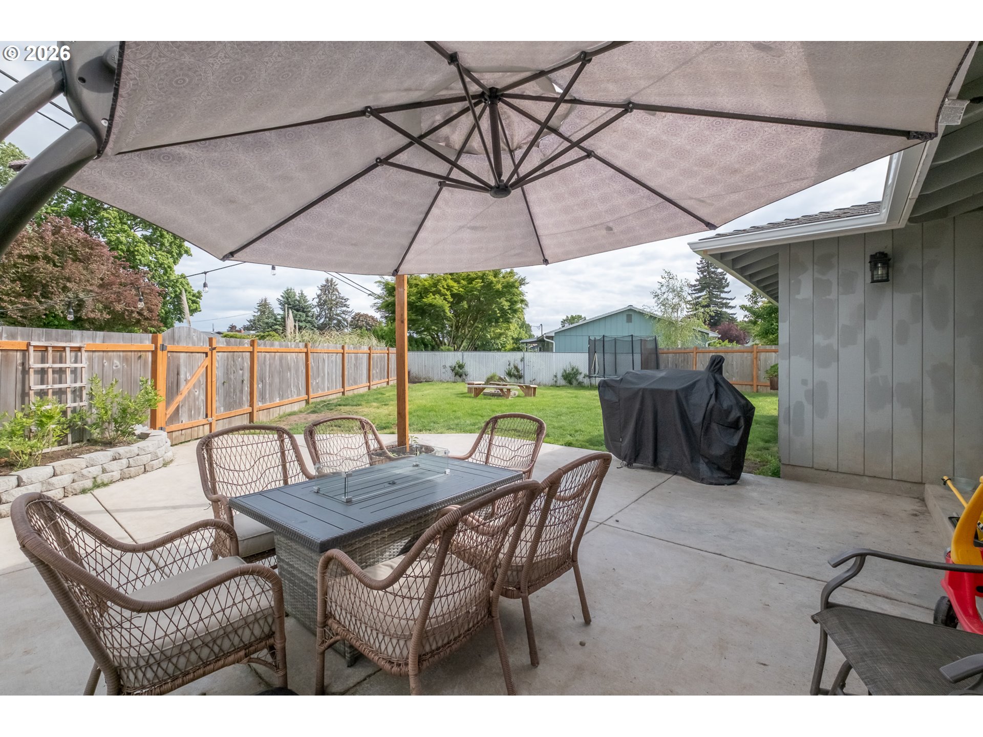 2261 Fulton Place Southeast Albany, OR 97322 - Photo 37 of 48 a view of a patio with a table and chairs under an umbrella