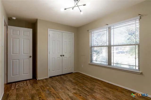 a view of a storage & utility room with dryer and washer