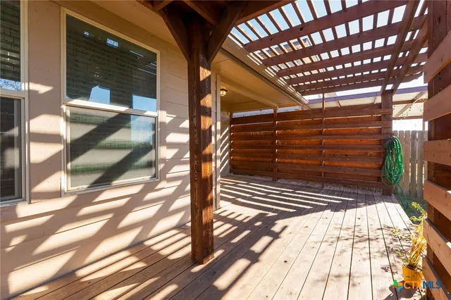 a view of a house with pool and a yard