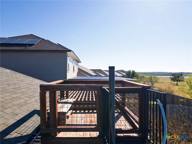 a view of a lake from a balcony