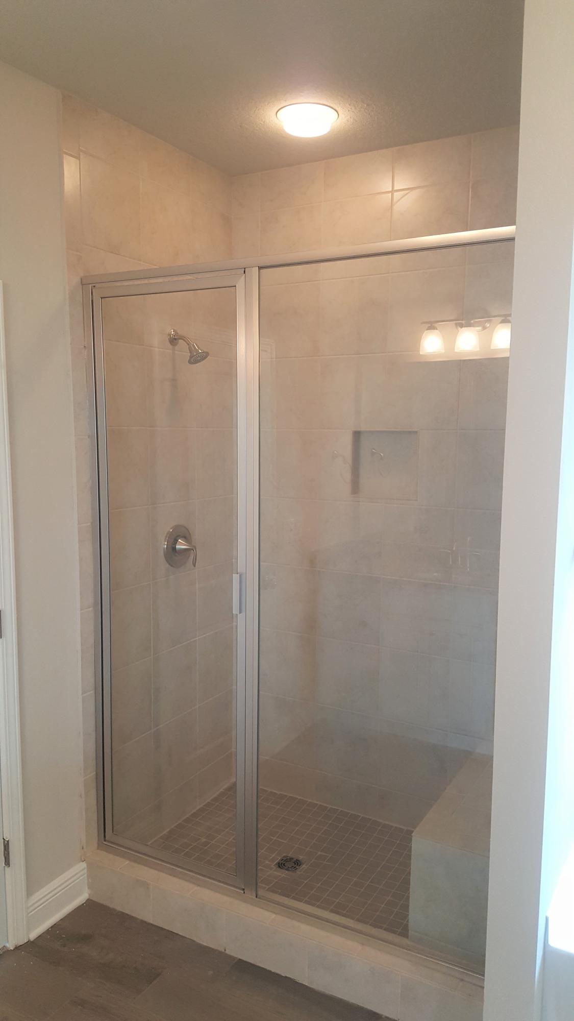 246 Conner Circle Santa Rosa Beach, FL 32459 - Photo 13 of 31 a bathroom with a glass shower door
