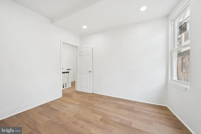 a view of an empty room with a window