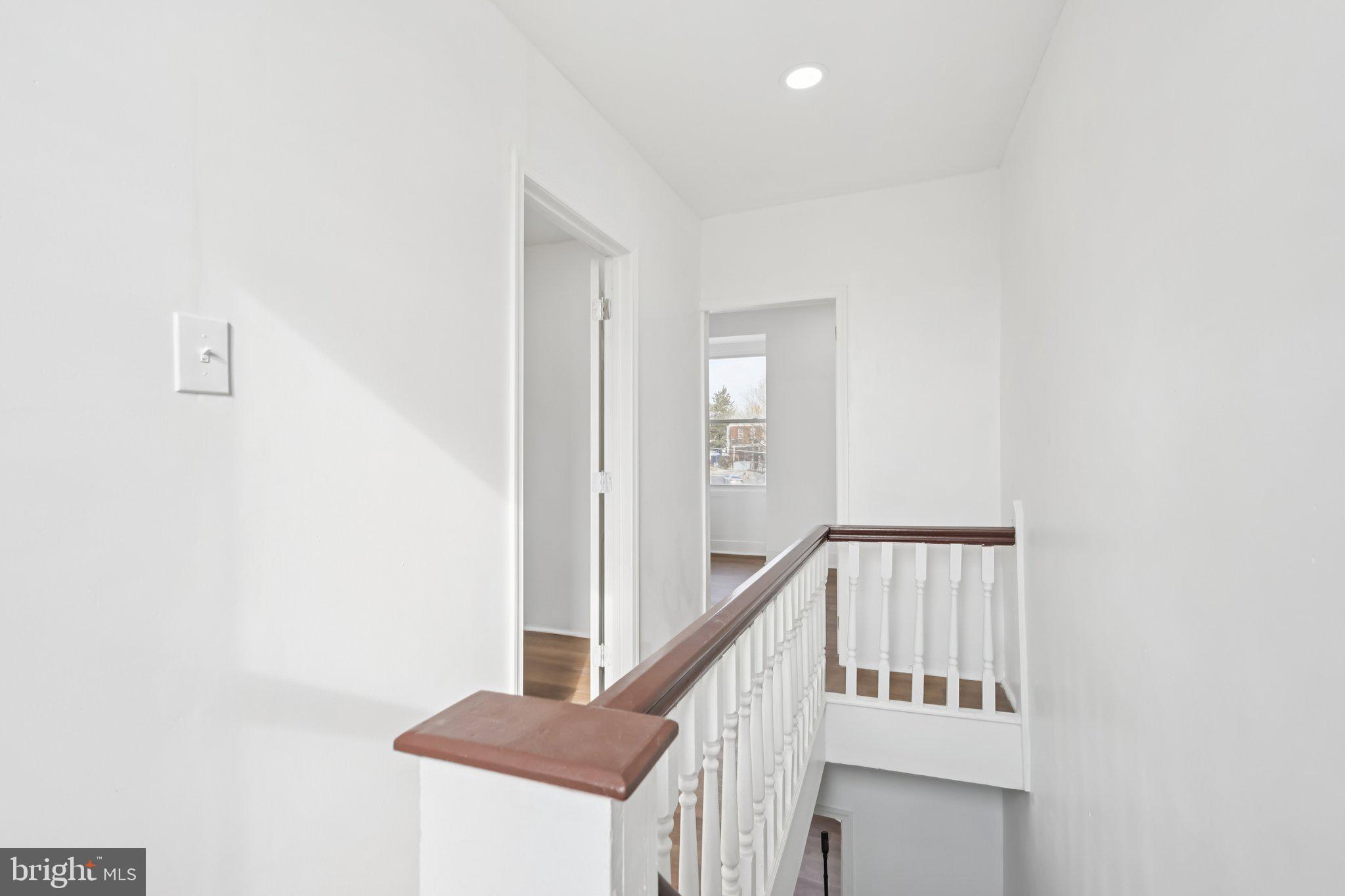 704 Main Street Darby, PA 19023 - Photo 20 of 28 a view of staircase with white walls and a window