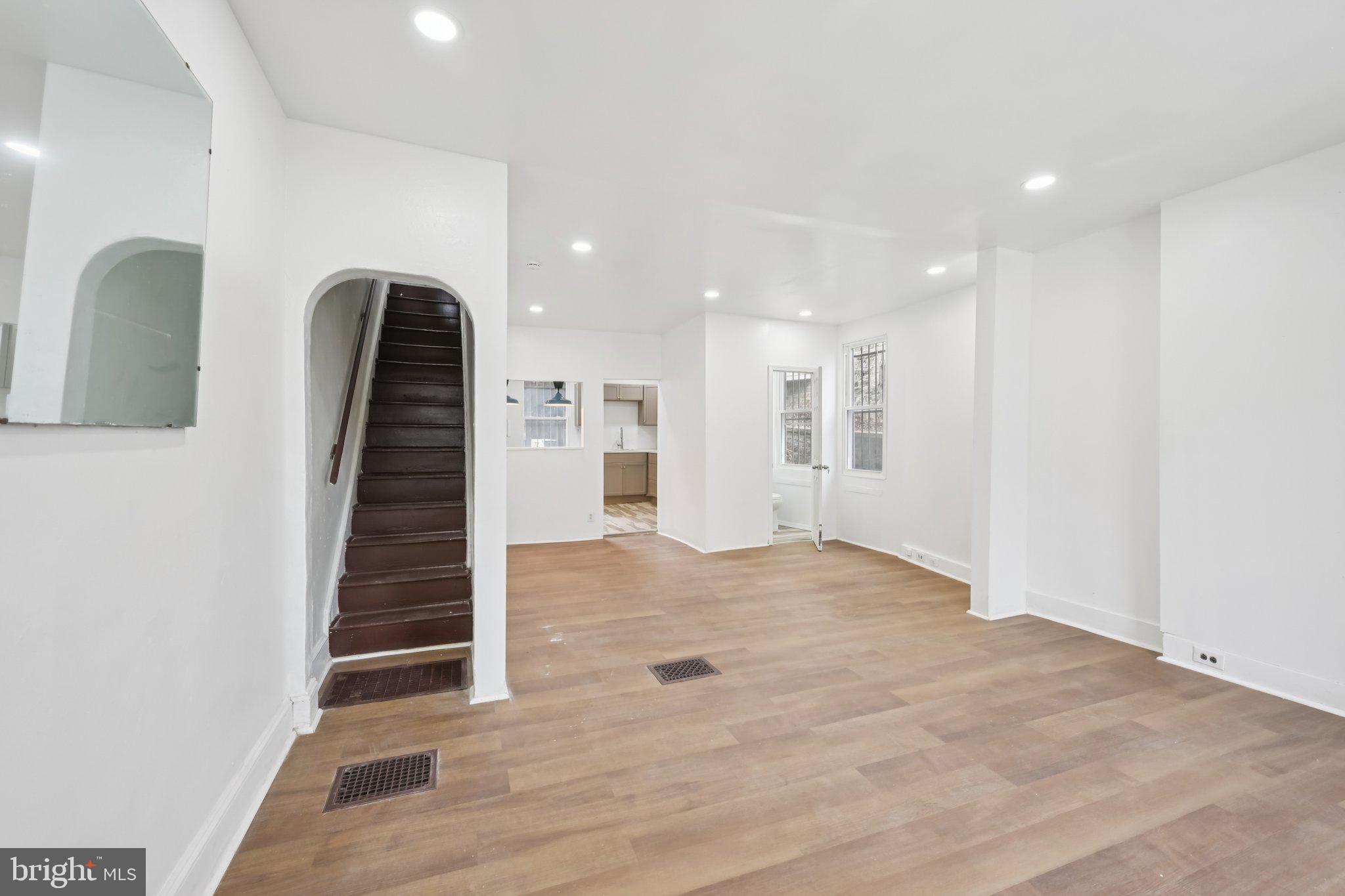 704 Main Street Darby, PA 19023 - Photo 3 of 28 a view of an empty room with wooden floor