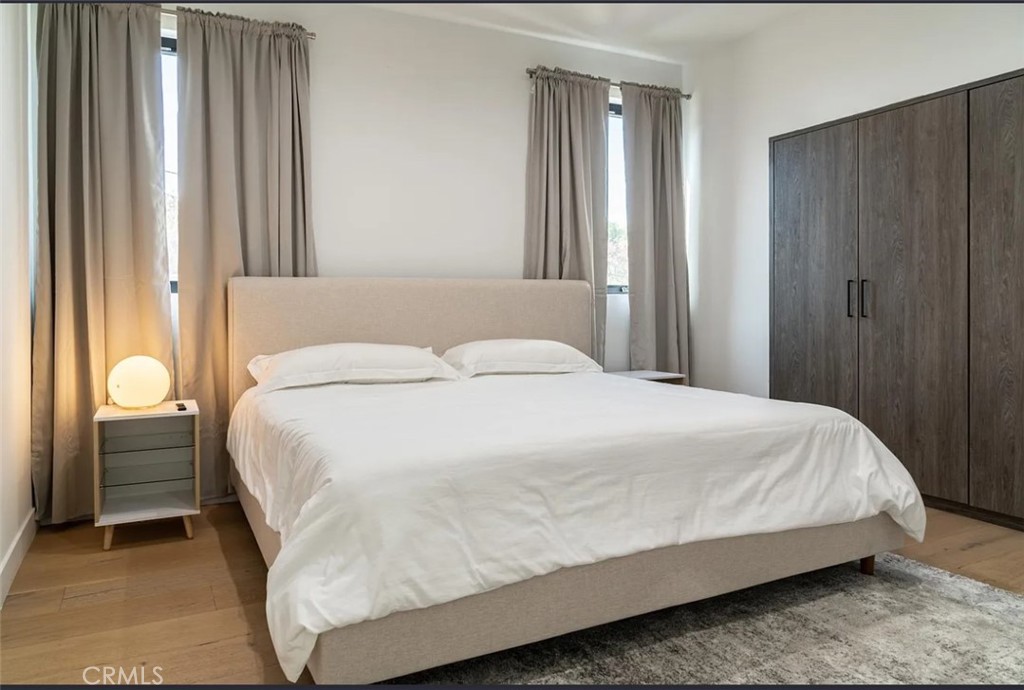 12134 Clarkson Road Los Angeles, CA 90064 - Photo 12 of 25 a bedroom with a bed and a window