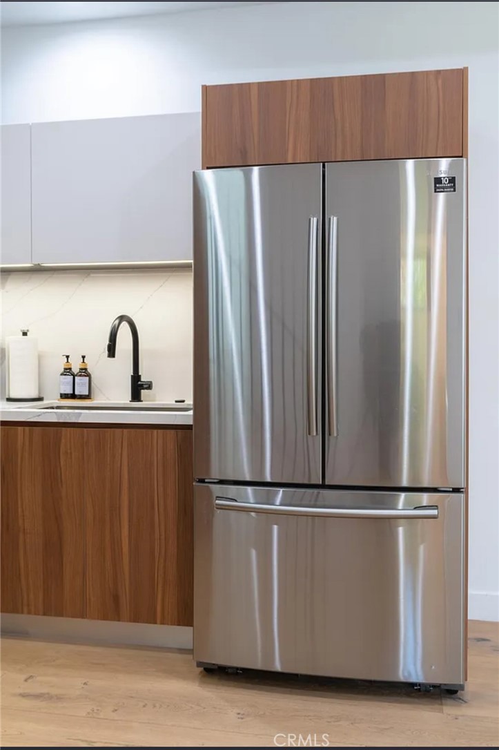 12134 Clarkson Road Los Angeles, CA 90064 - Photo 14 of 25 a kitchen with stainless steel appliances granite countertop a refrigerator and a sink