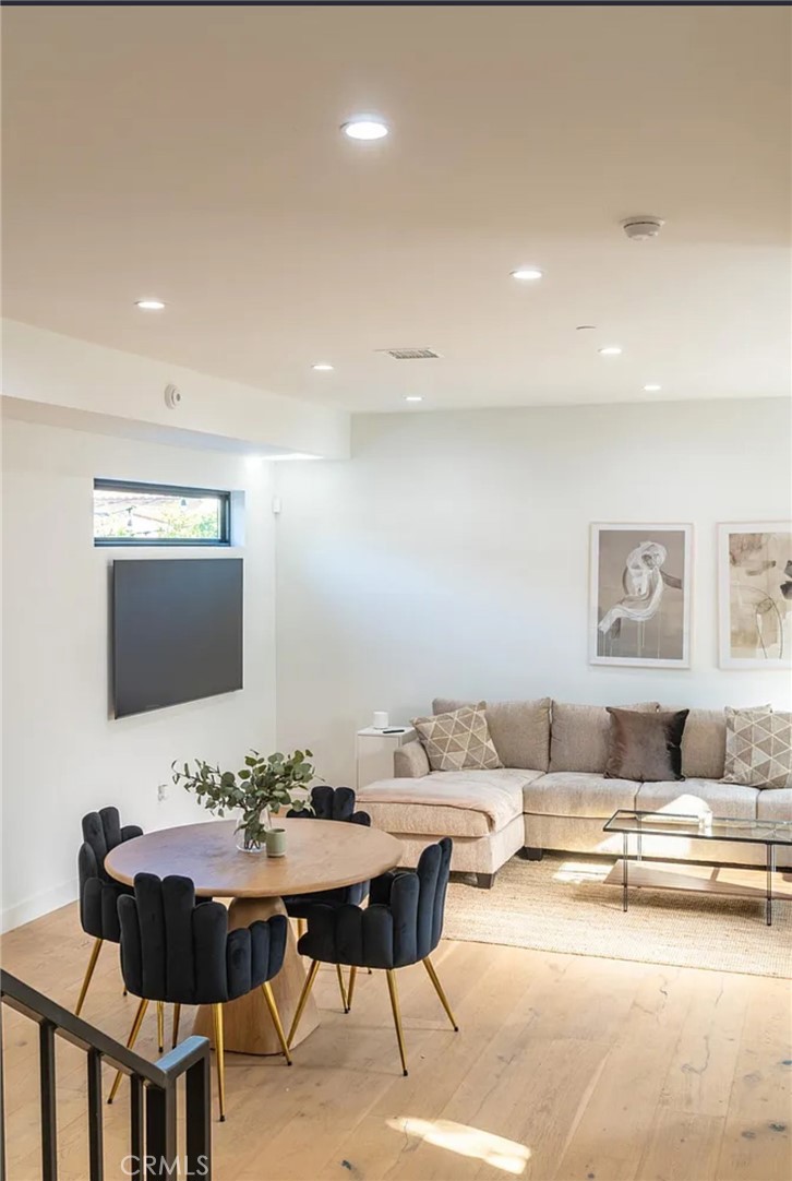 12134 Clarkson Road Los Angeles, CA 90064 - Photo 16 of 25 a living room with furniture and a flat screen tv