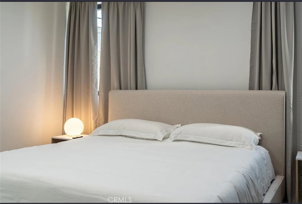 12134 Clarkson Road Los Angeles, CA 90064 - Photo 17 of 25 a bedroom with a bed and window