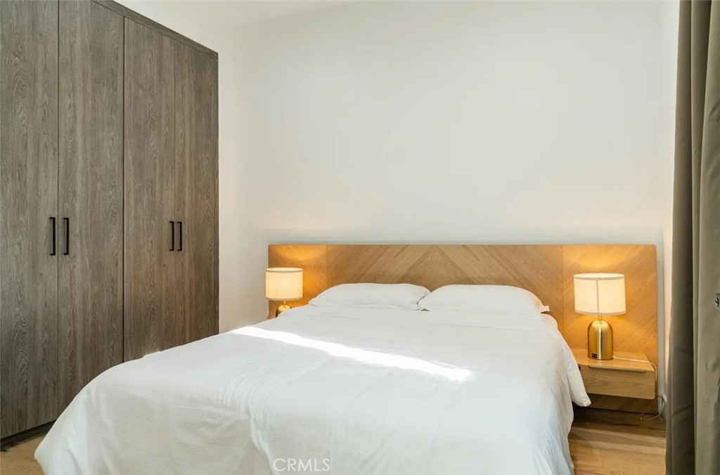 12134 Clarkson Road Los Angeles, CA 90064 - Photo 19 of 25 a bedroom with a bed and a table