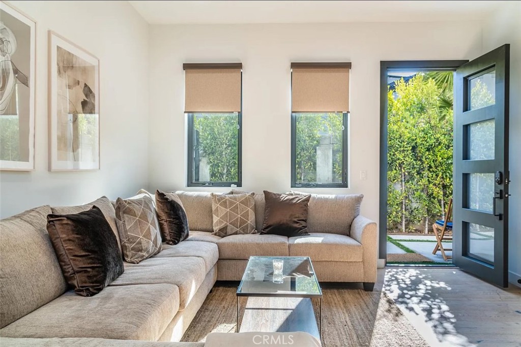 12134 Clarkson Road Los Angeles, CA 90064 - Photo 2 of 25 a living room with furniture and a large window