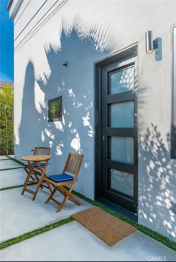 12134 Clarkson Road Los Angeles, CA 90064 - Photo 24 of 25 a view of a front door of house with outdoor seating space