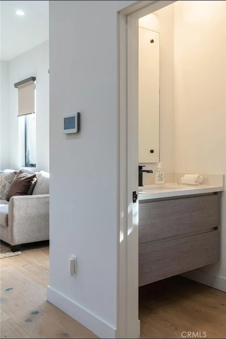 12134 Clarkson Road Los Angeles, CA 90064 - Photo 8 of 25 a bathroom with a sink and a mirror