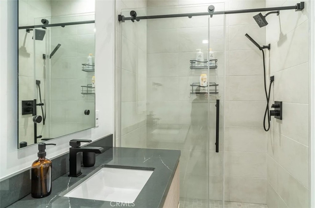 12134 Clarkson Road Los Angeles, CA 90064 - Photo 9 of 25 a bathroom with a bathtub and a shower