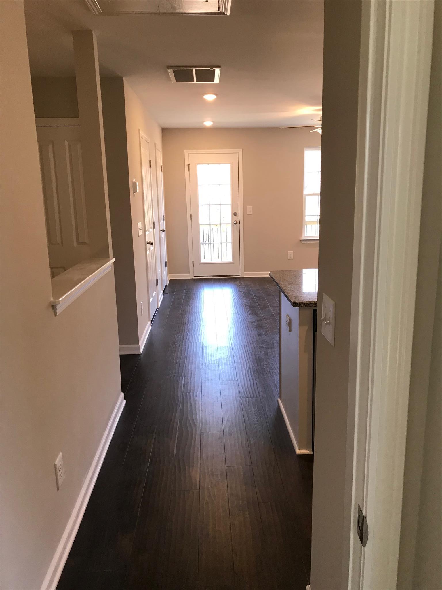 2016 Middle Tennessee Boulevard Murfreesboro, TN 37130 - Photo 11 of 21 Hall view from bedrm upstairs facing Kitchen and Great Rm-going out to privacy deck! same plan but not townhome listed.