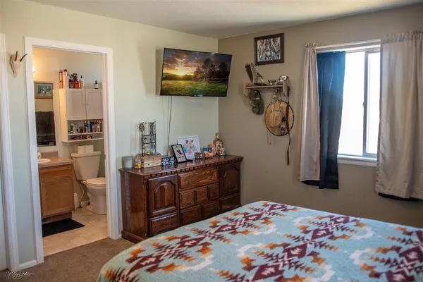 a bedroom with a bed and furniture