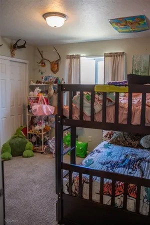 a bedroom with furniture and a window