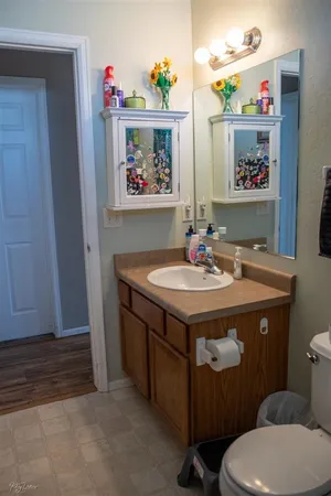 a view of bathroom with sink and mirror