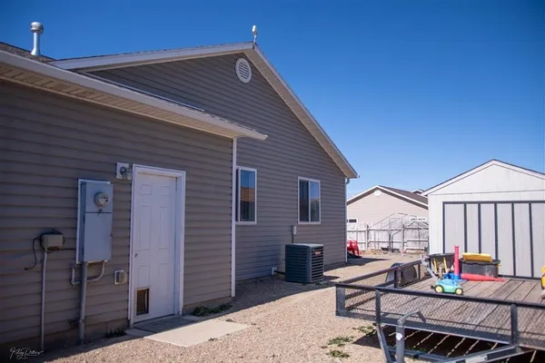 a backyard of a house with outdoor seating