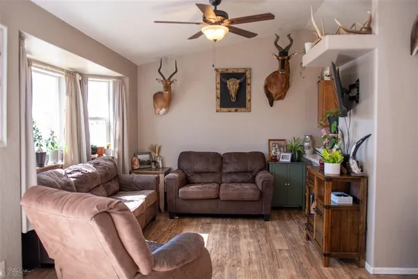 a living room with furniture and a window