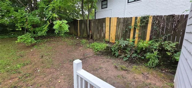 a view of a backyard with plants