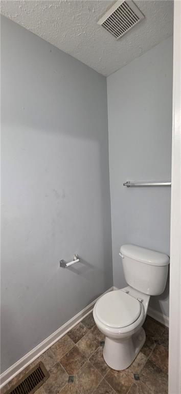 688 Smith Street Southwest Atlanta, GA 30310 - Photo 5 of 15 a white toilet sitting next to a shower