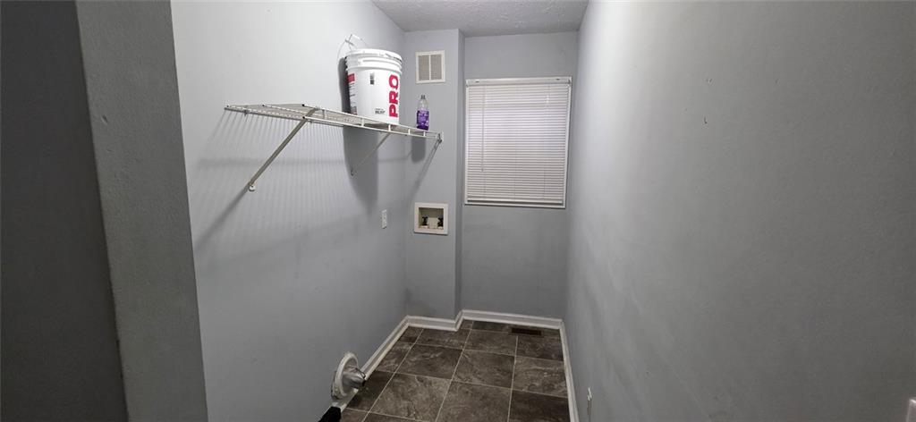 688 Smith Street Southwest Atlanta, GA 30310 - Photo 6 of 15 a view of a room with rack on the wall