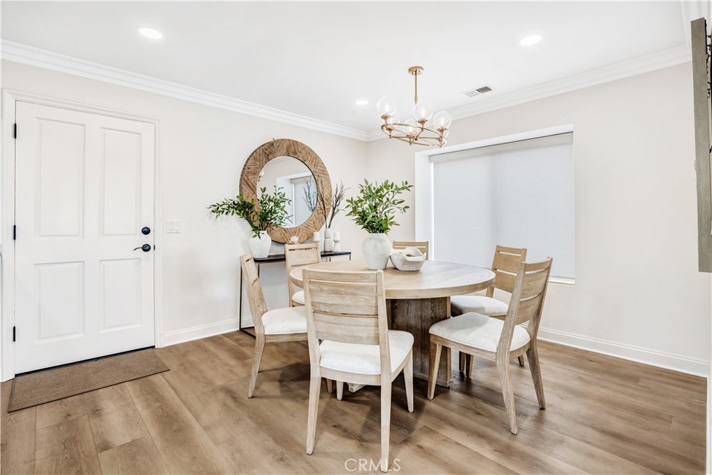 32041 Point Place Laguna Beach, CA 92651 - Photo 14 of 49 a dining room with furniture a chandelier and wooden floor