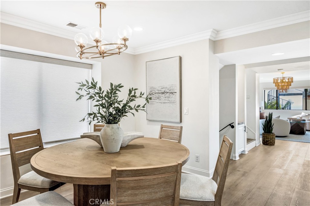 32041 Point Place Laguna Beach, CA 92651 - Photo 15 of 49 a view of a dining room with furniture and a chandelier