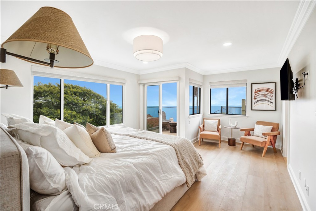 32041 Point Place Laguna Beach, CA 92651 - Photo 23 of 49 a bedroom with a bed couch and window