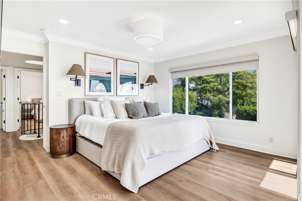 32041 Point Place Laguna Beach, CA 92651 - Photo 24 of 49 a large white bed sitting in a bedroom next to a window