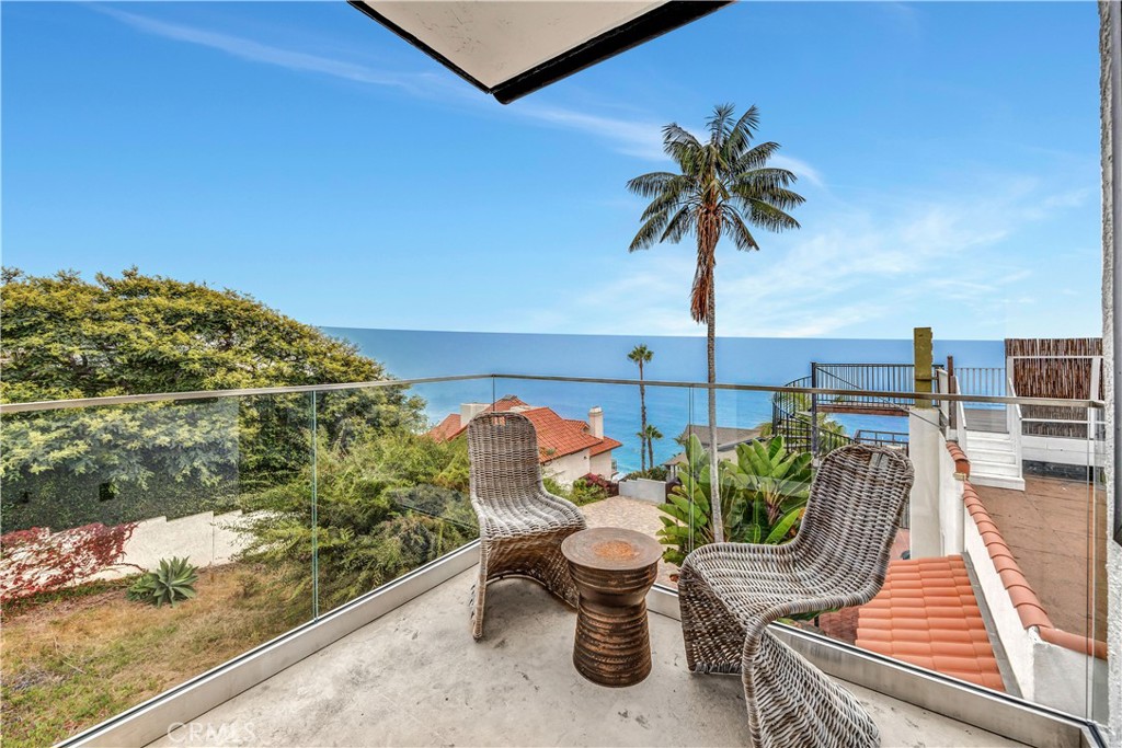 32041 Point Place Laguna Beach, CA 92651 - Photo 25 of 49 a balcony with table and chairs