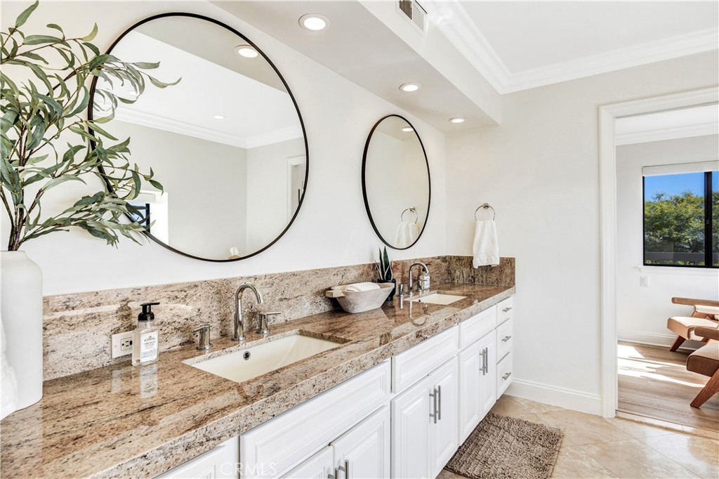 32041 Point Place Laguna Beach, CA 92651 - Photo 27 of 49 a bathroom with a granite countertop double vanity sinks and a mirror