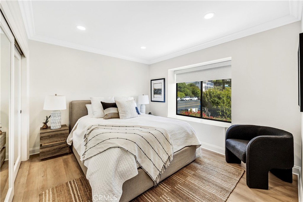 32041 Point Place Laguna Beach, CA 92651 - Photo 32 of 49 a bed room with a bed and a chair