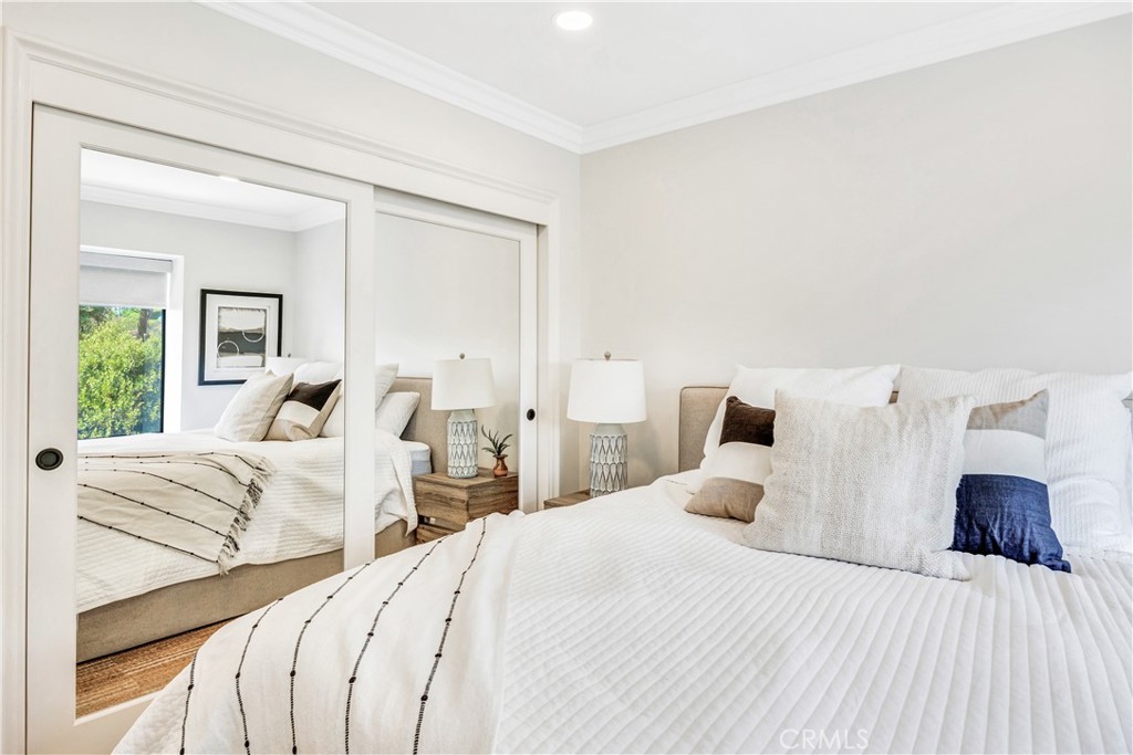 32041 Point Place Laguna Beach, CA 92651 - Photo 34 of 49 a bedroom with a bed and large windows