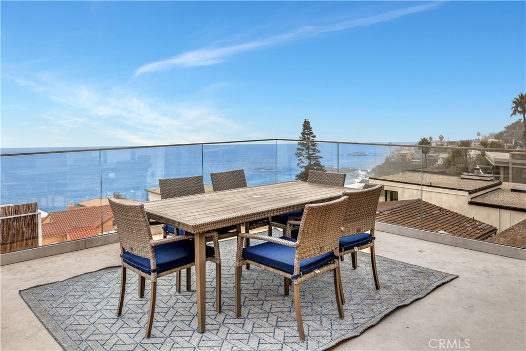 32041 Point Place Laguna Beach, CA 92651 - Photo 48 of 49 a roof deck with a table and chairs
