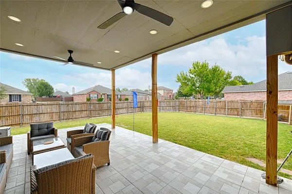 a view of swimming pool with outdoor seating