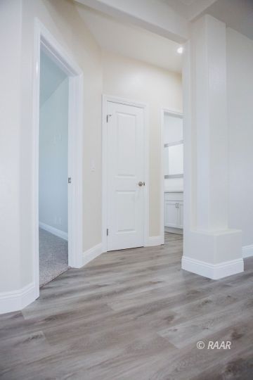 1124 Marbella Drive Ridgecrest, CA 93555 - Photo 8 of 14 a view of empty room with wooden floor