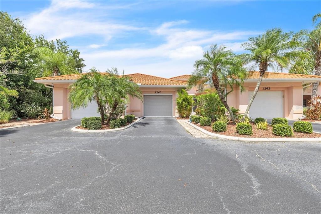 1260 Rio De Janeiro Avenue, Unit 102 Punta Gorda, FL 33983 - Photo 3 of 46 front view of a house with a street